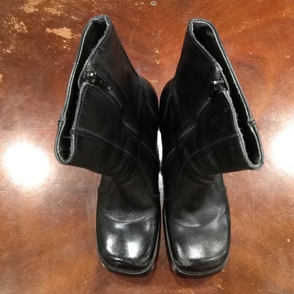 Black high heel boots.